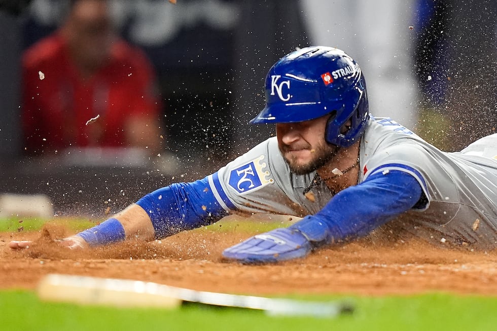 Kansas City Royals Garrett Hampson (2) scores on a hit against the New York Yankees during the...