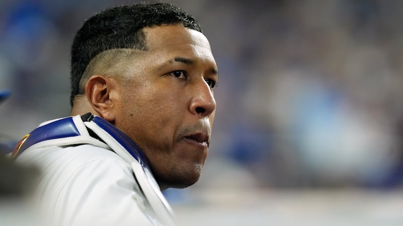 Kansas City Royals' Salvador Perez watches from the dugout during the fifth inning in Game 4...