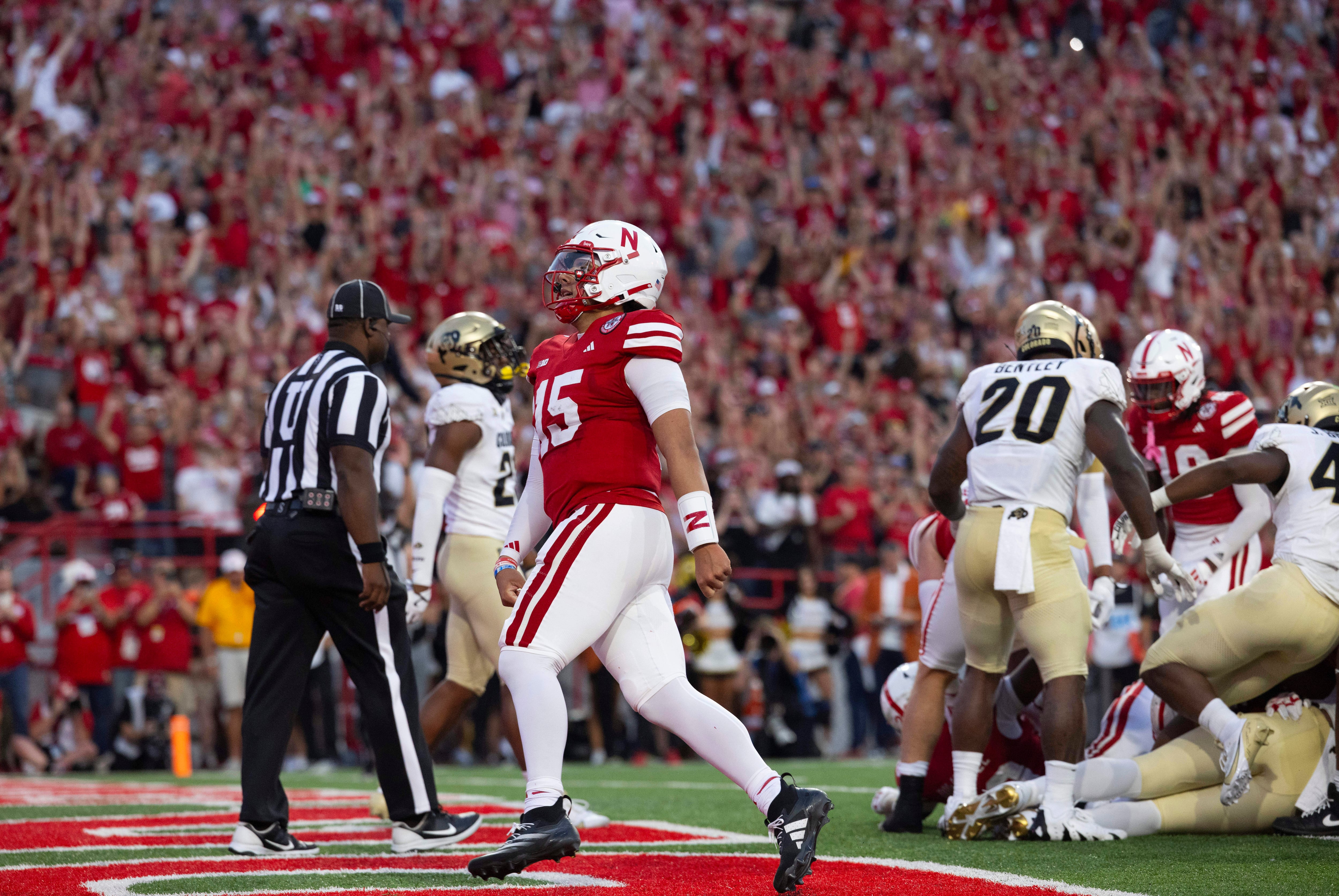 Nebraska quarterback Dylan Raiola (15) celebrates following a touchdown by Dante Dowdell, not...