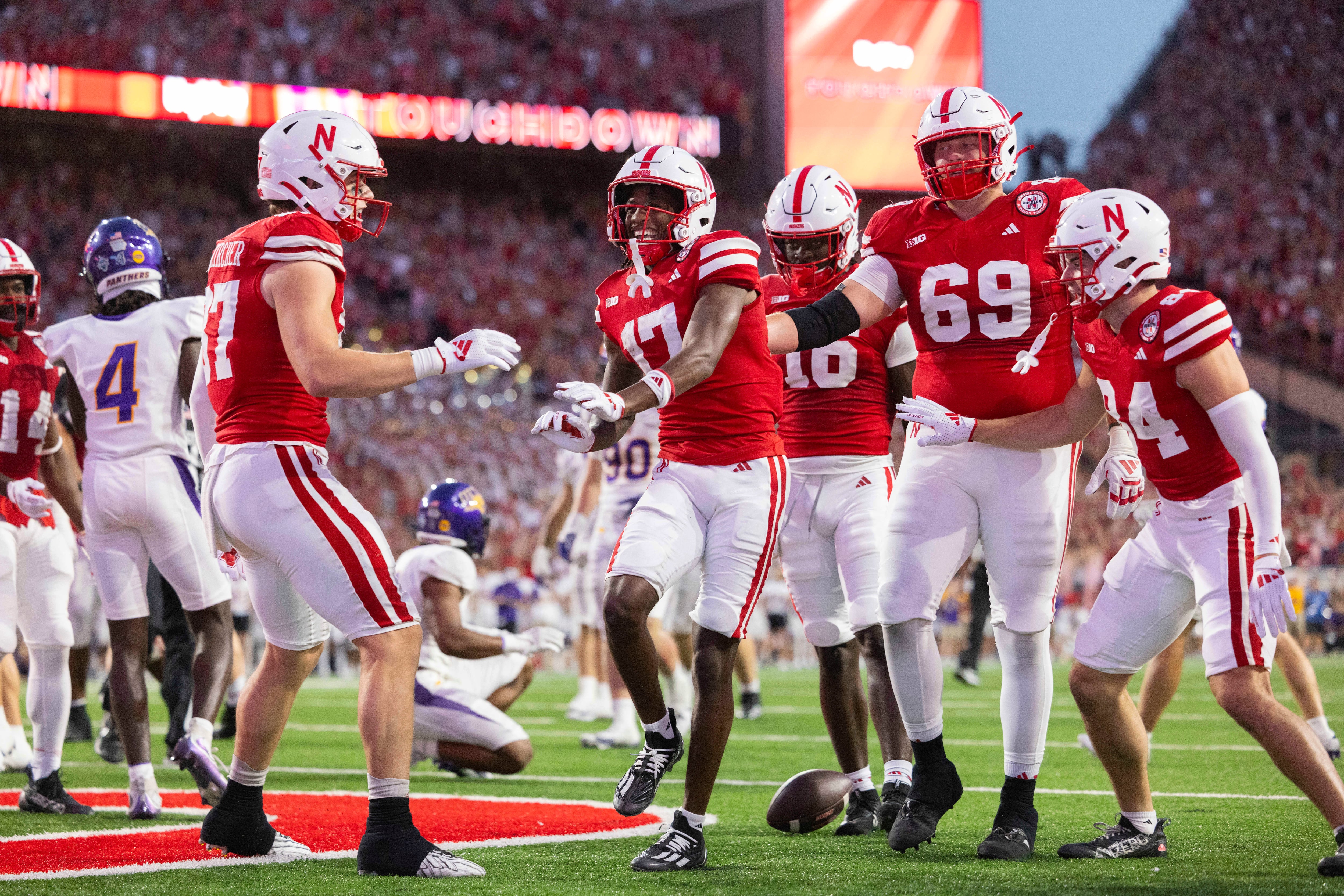 Nebraska wide receiver Jacory Barney Jr., center, celebrates after scoring a touchdown...