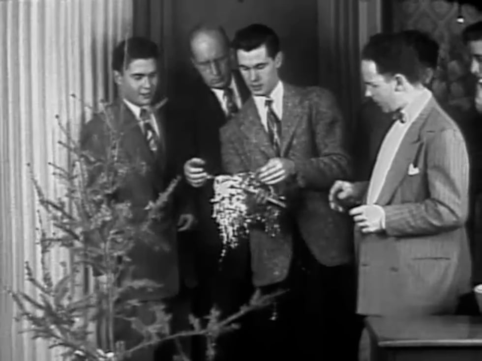 Johnny Carson tries to get his team excited about decorating a tree for the 1950 Christmas Day...